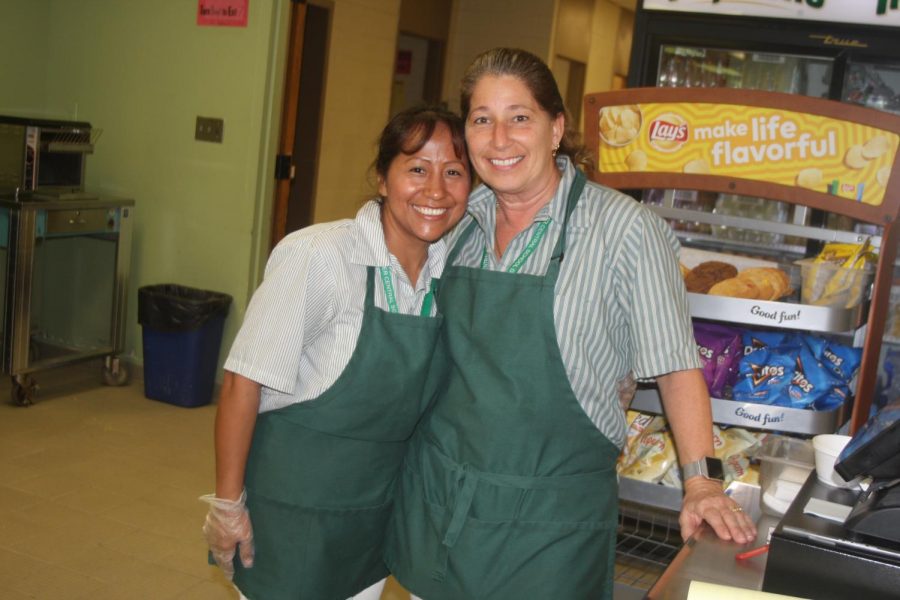 They’re more than just a pretty face!  Now you can greet them by name each and every day.  Make sure to thank them for everything they do, as not only do they serve up hot, fresh, nutritious meals, but they also do it with a smile.  Pictured, Norma and Patricia.