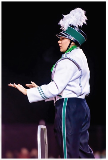 Drum Major Joy Johnson expertly unifies not only four years of academia but also the Brewster High School marching band.