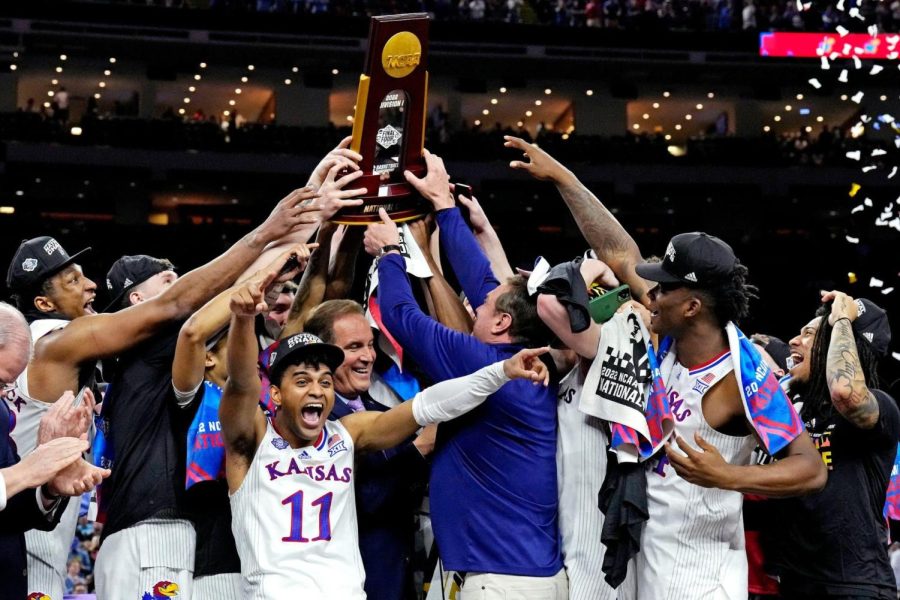 Jawhawk team members react to achieving the largest comeback in NCAA title history, a sixteen point deficit, to deservedly earning the national championship. (Photo courtesy Reuters Photo)