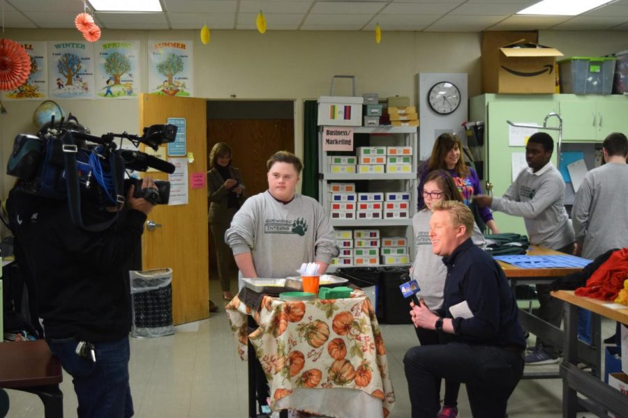 Haley Riolo is interviewed by Gus Rosendale while Max Michinko serves breakfast.