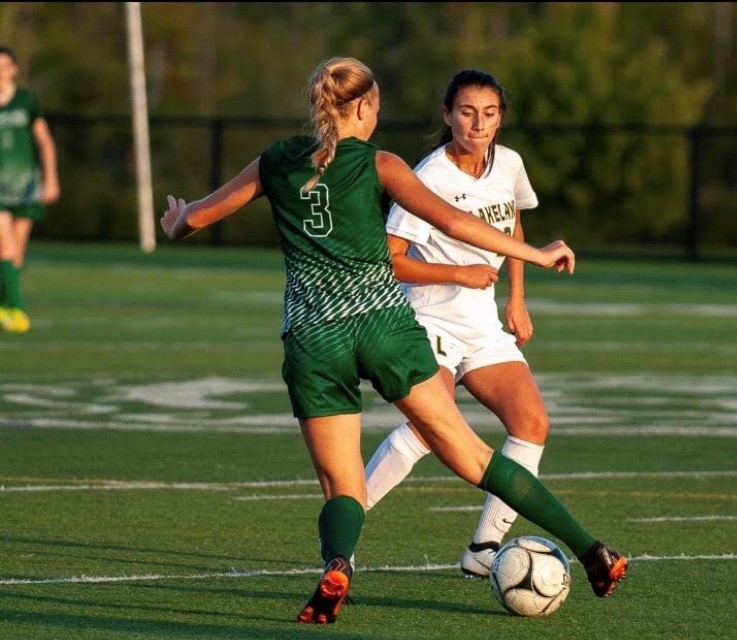 Soccer player Gabriela Jakobsen (3) outmaneuvers a rival for control of the ball during her last playing season.