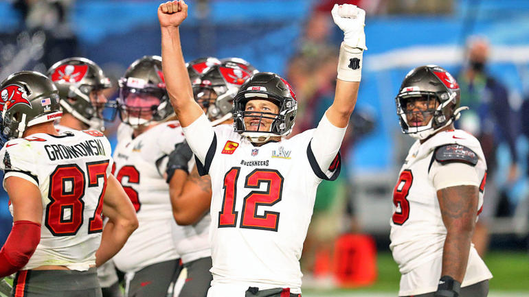 Tamp Bay quarterback Tom Brady raises his arms in celebration, enjoying an increase in the number of Super Bowls he has won.