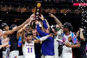 Jawhawk team members react to achieving the largest comeback in NCAA title history, a sixteen point deficit, to deservedly earning the national championship. (Photo courtesy Reuters Photo)