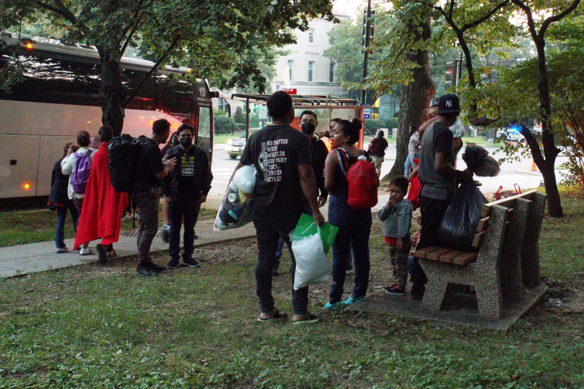 A group of Venezuelan migrants have just been dropped off in front of VP Kamala Harris’ home after being sent by bus from a Texas detention center. (Photo courtesy Reuters)