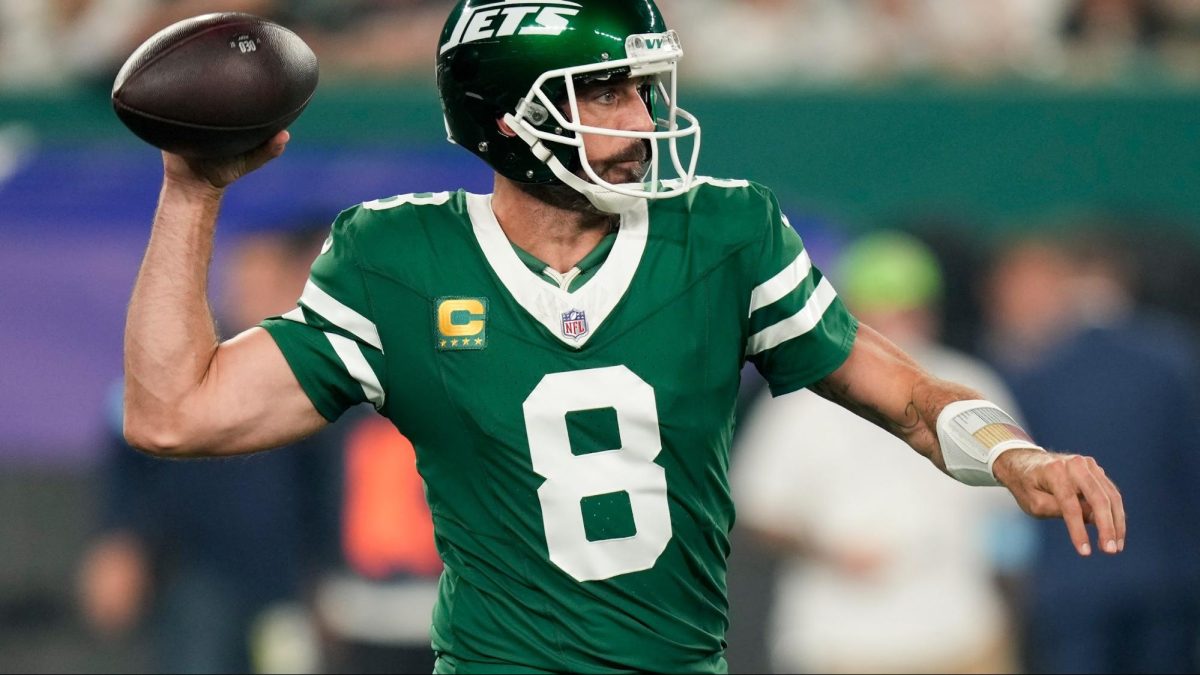 Former Jets quarterback, Aaron Rodgers, is currently a free agent, with multiple potential targets that he could be signed by. But how do teams meet final contract terms through negotiation? (Photos courtesy AP Photo/Seth Wenig)